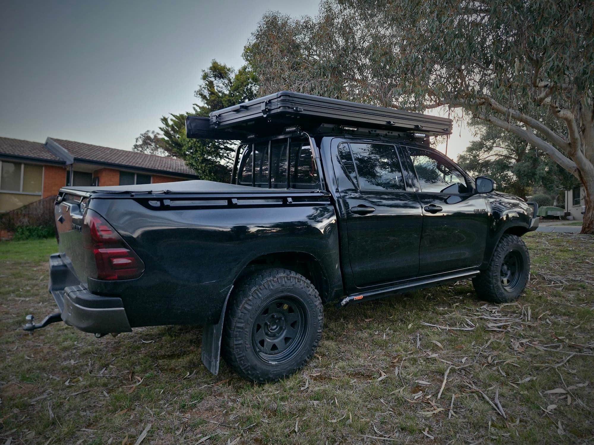Rear of the Hilux build: canopy, tent and tow bar